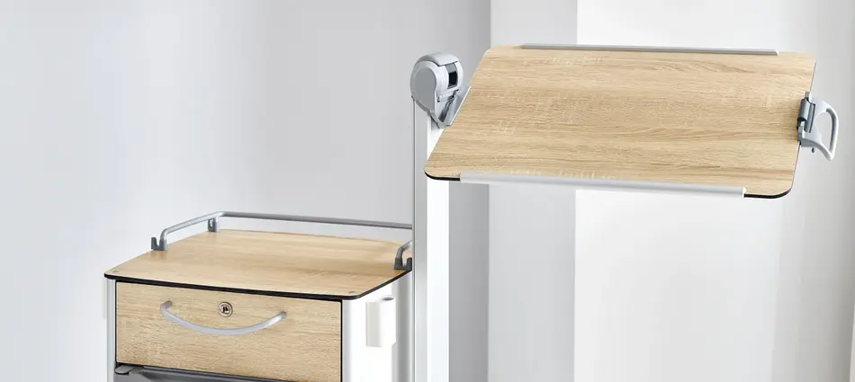 Tilting overbed table top on the Vitano bedside cabinet