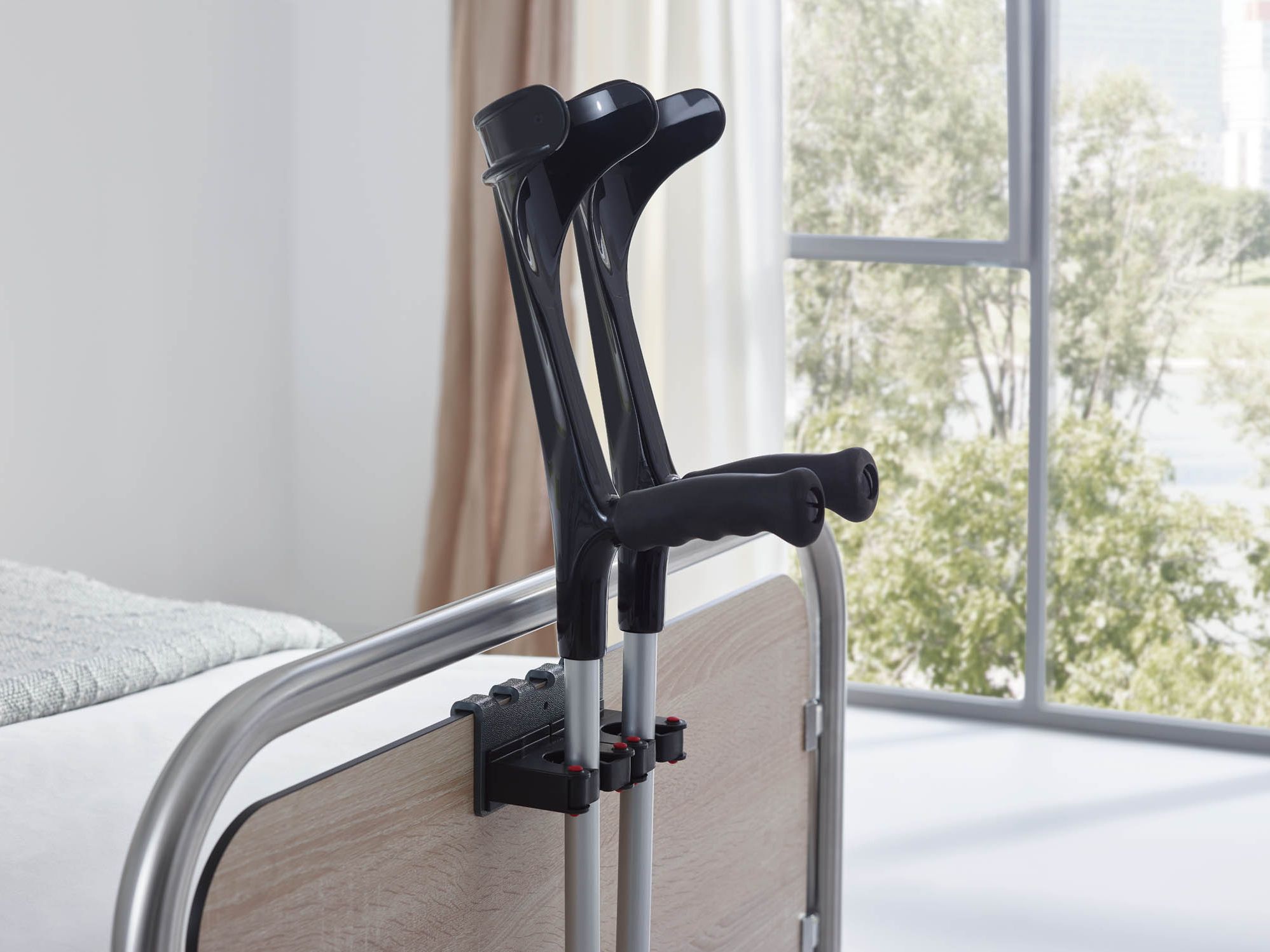 Crutch holders for beds and bedside lockers