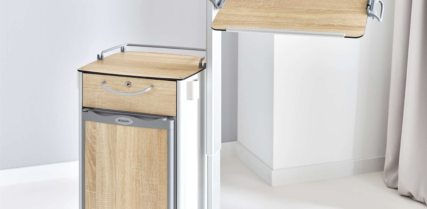Tilting overbed table top on the Vitano bedside cabinet