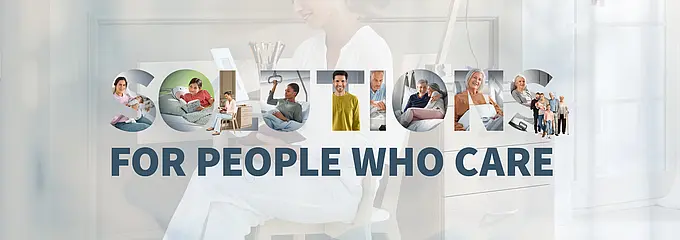 Motyw kampanii firmy Stiegelmeyer przedstawiający kobietę przy biurku oraz hasło „Solutions for people who care”
